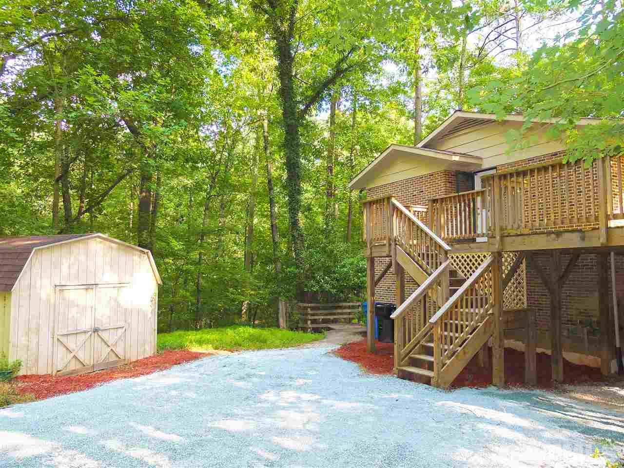 6808 Laurdane Road Raleigh, NC 27613 - Photo 12 of 25 a view of a house with a yard