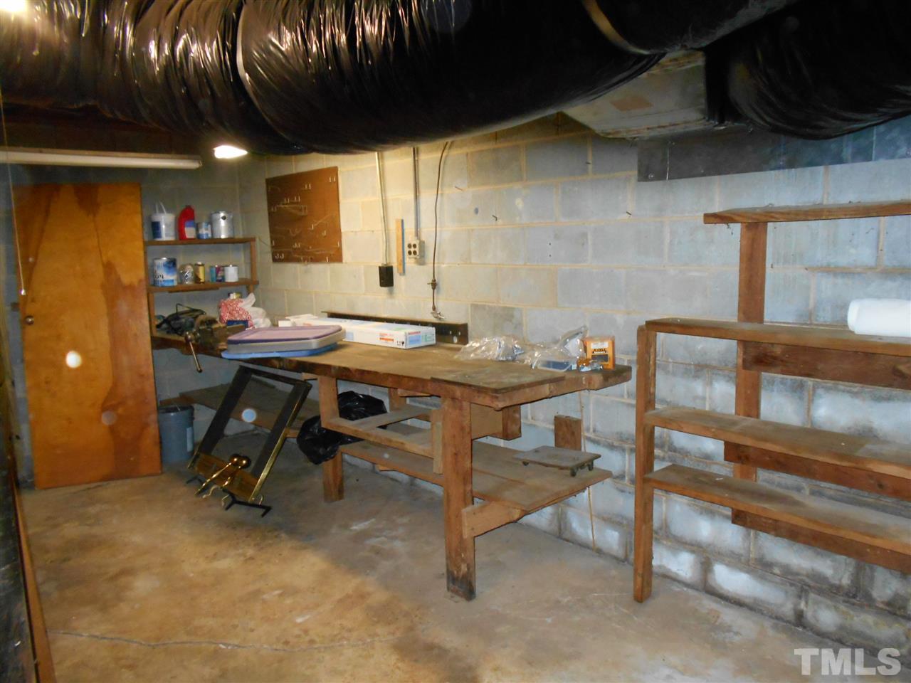 6808 Laurdane Road Raleigh, NC 27613 - Photo 15 of 25 a view of a room with a table and chairs