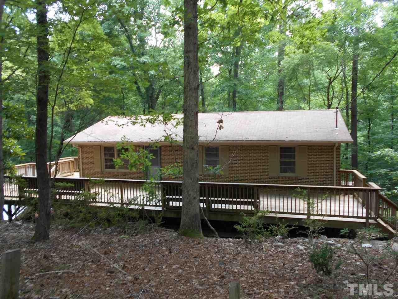 6808 Laurdane Road Raleigh, NC 27613 - Photo 19 of 25 a view of a house with a yard