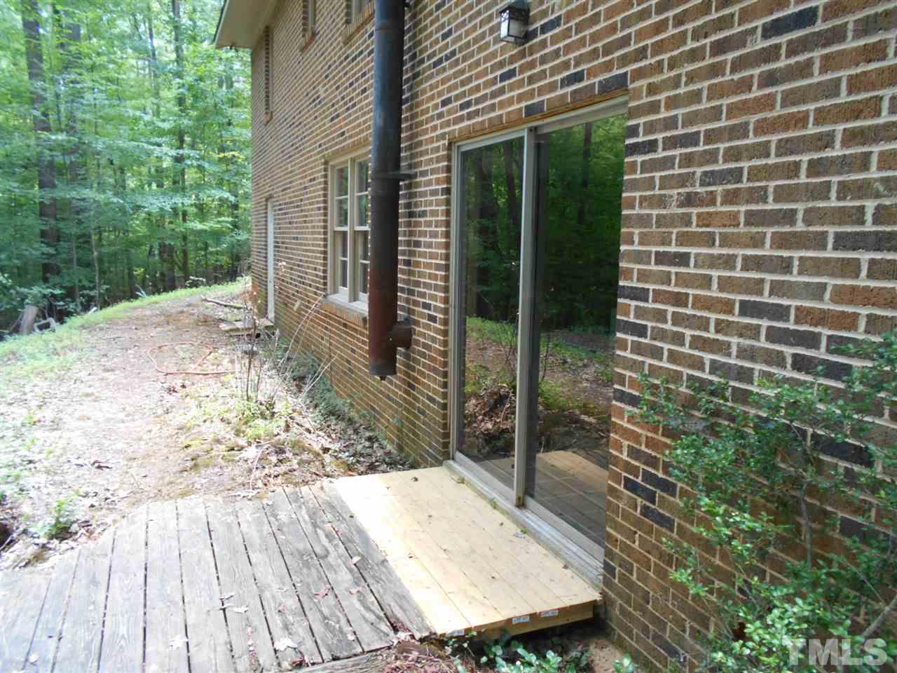 6808 Laurdane Road Raleigh, NC 27613 - Photo 24 of 25 a view of a backyard with sitting area