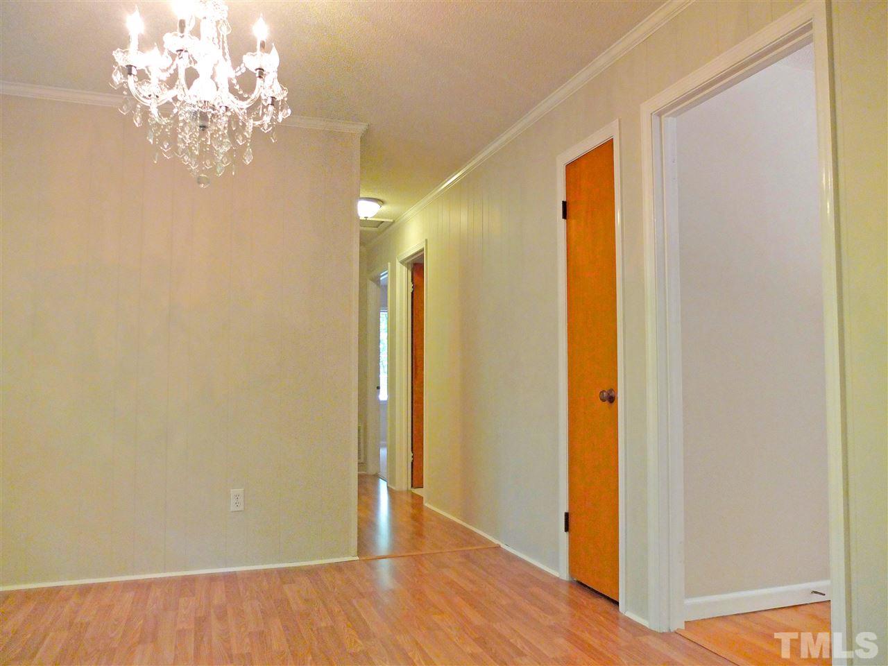 6808 Laurdane Road Raleigh, NC 27613 - Photo 4 of 25 a view of a chandelier in a room