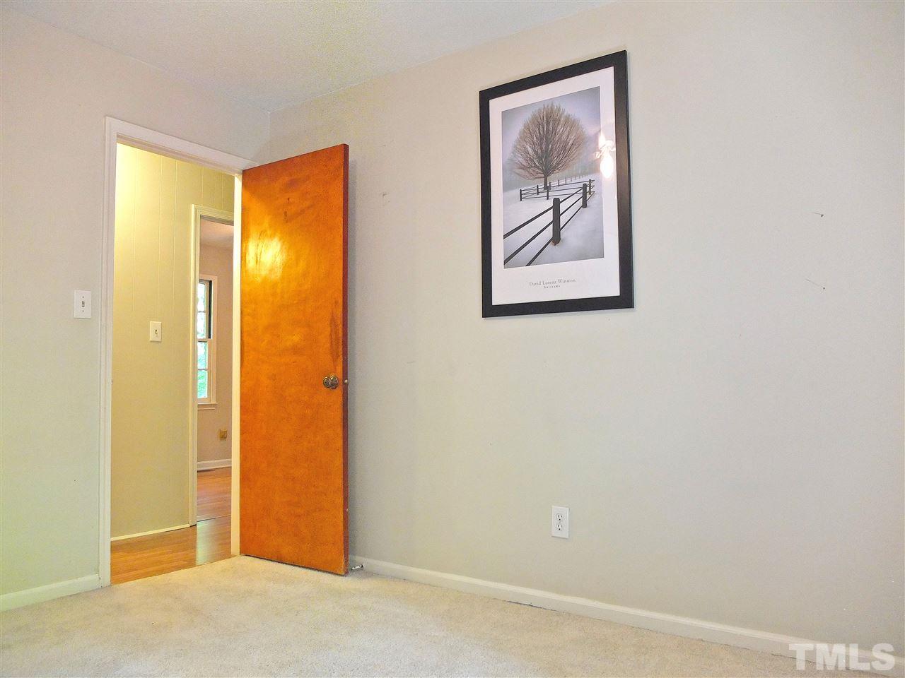 6808 Laurdane Road Raleigh, NC 27613 - Photo 5 of 25 a view of a small space with wooden floor