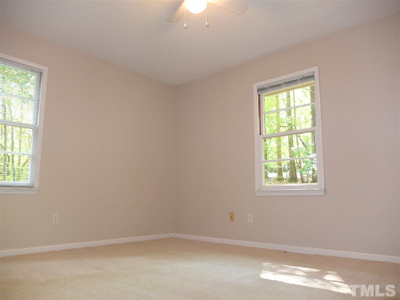 6808 Laurdane Road Raleigh, NC 27613 - Photo 6 of 25 an empty room with a window