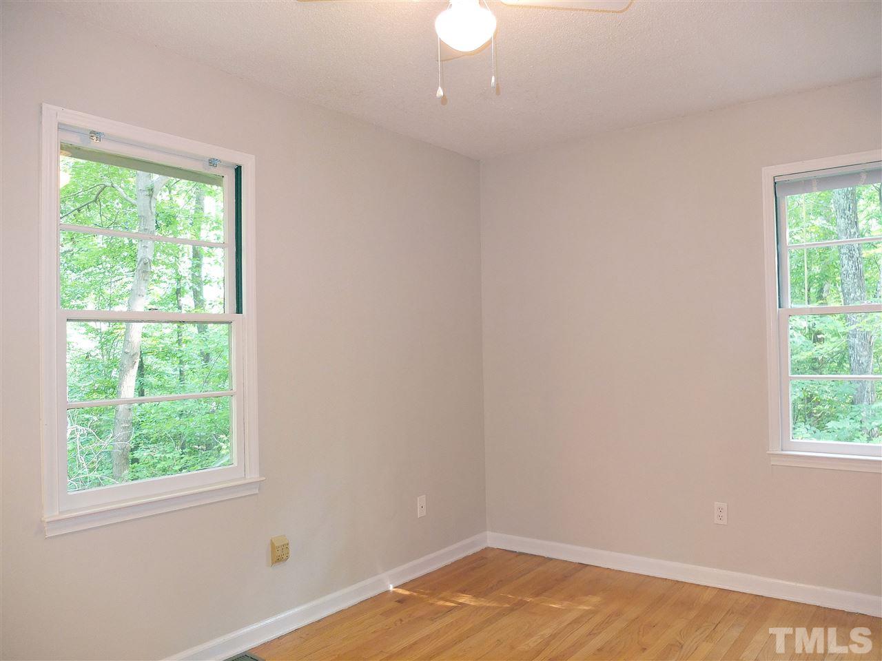 6808 Laurdane Road Raleigh, NC 27613 - Photo 7 of 25 an empty room with a window