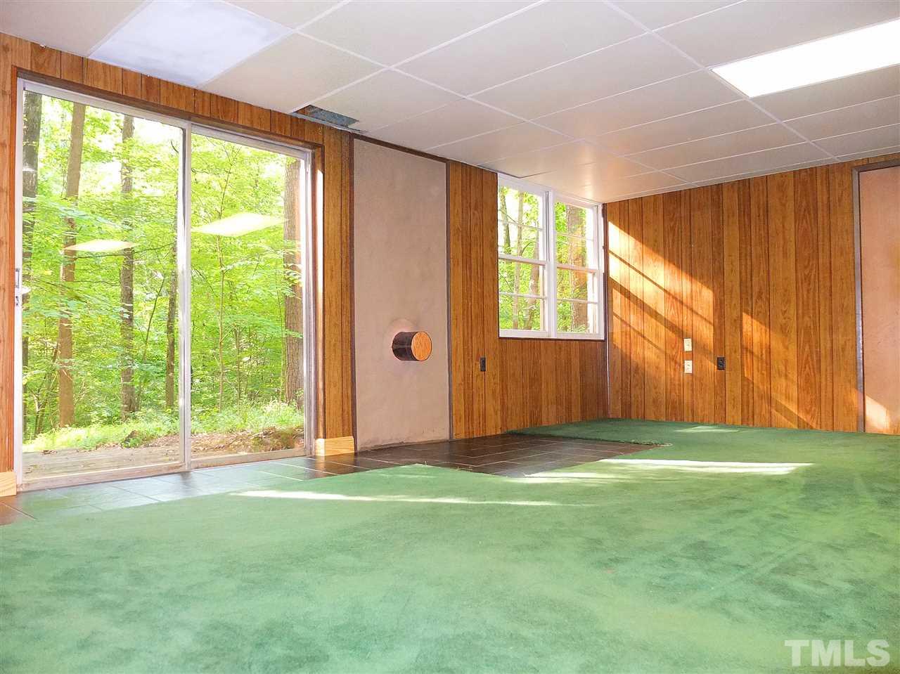 6808 Laurdane Road Raleigh, NC 27613 - Photo 9 of 25 a view of a room with window and a yard