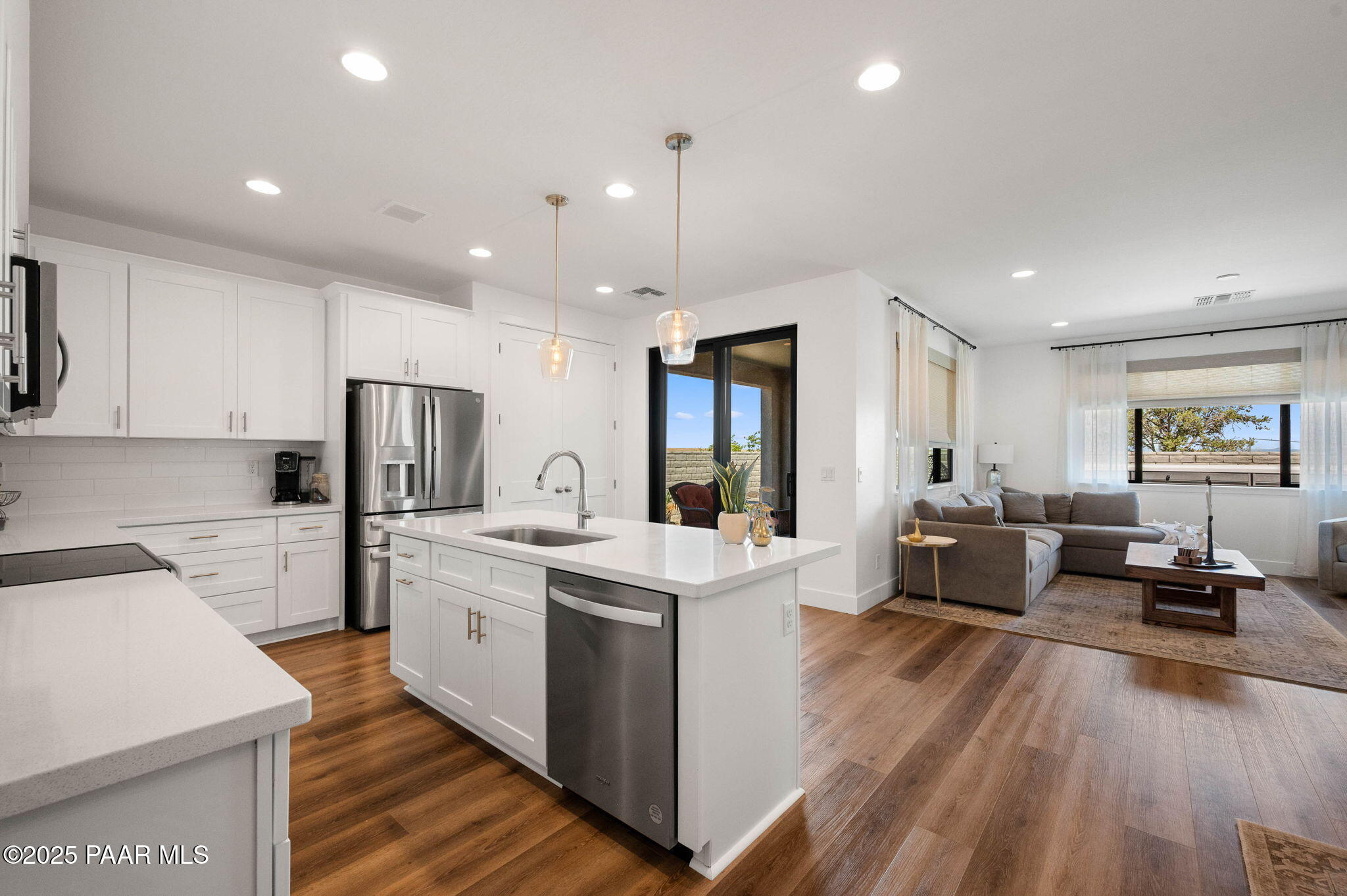 5902 Finch Place Prescott Valley, AZ 86314 - Photo 13 of 116 a large kitchen with stainless steel appliances kitchen island a large counter top a sink a stove and a refrigerator
