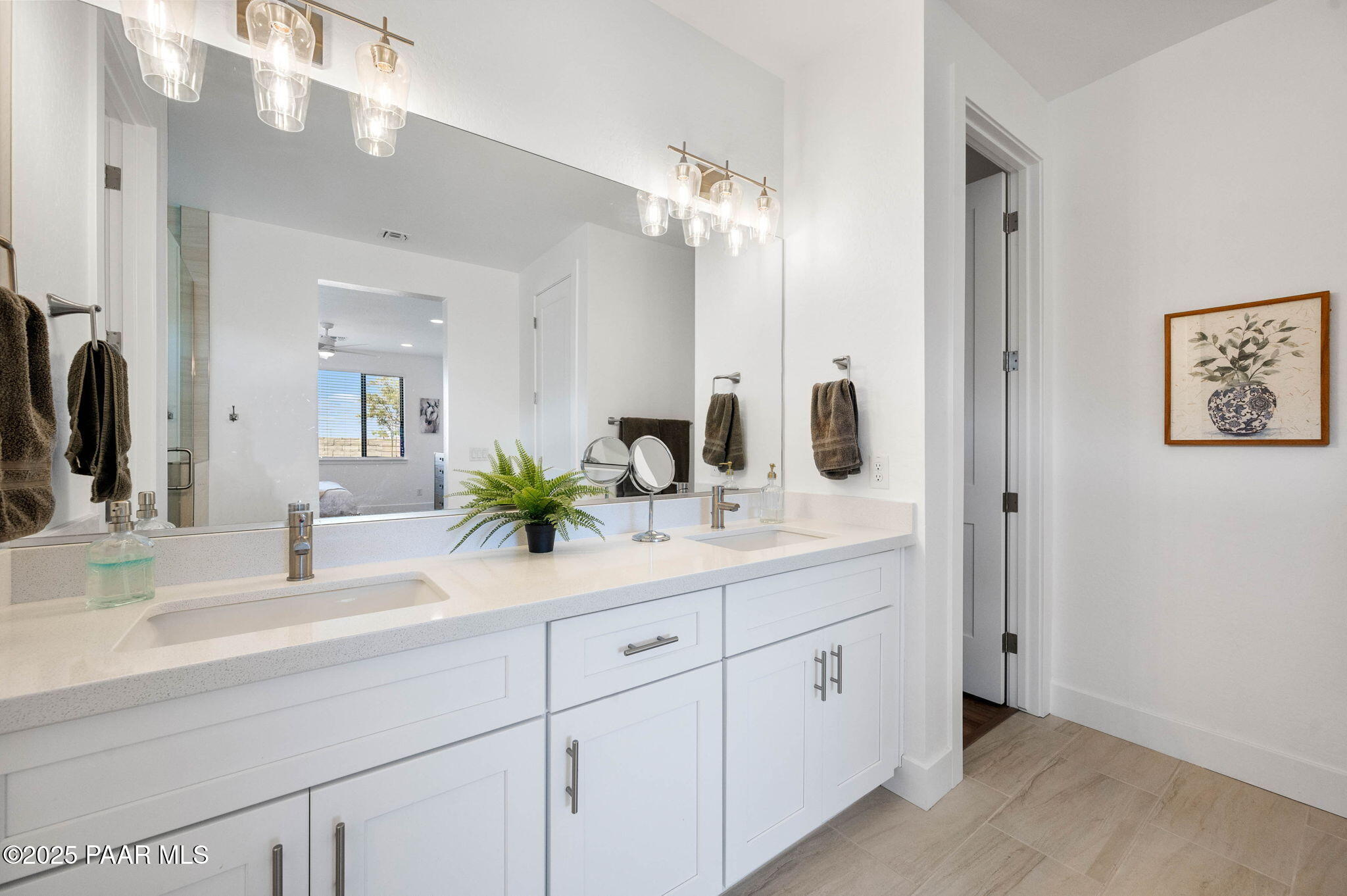 5902 Finch Place Prescott Valley, AZ 86314 - Photo 21 of 116 a bathroom with a double vanity sink mirror and next to a window