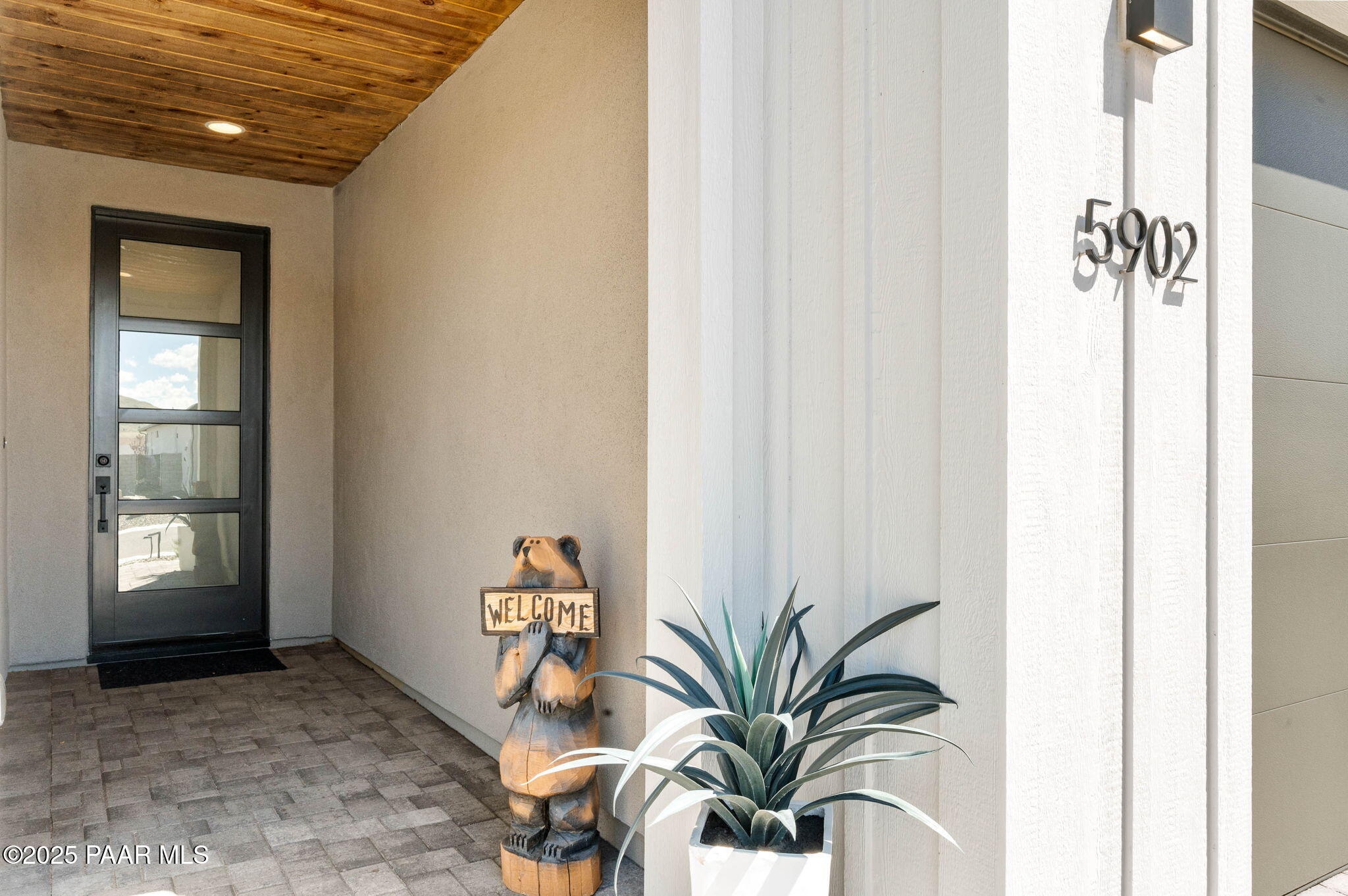 5902 Finch Place Prescott Valley, AZ 86314 - Photo 4 of 116 a view of a hallway with potted plants and glass door