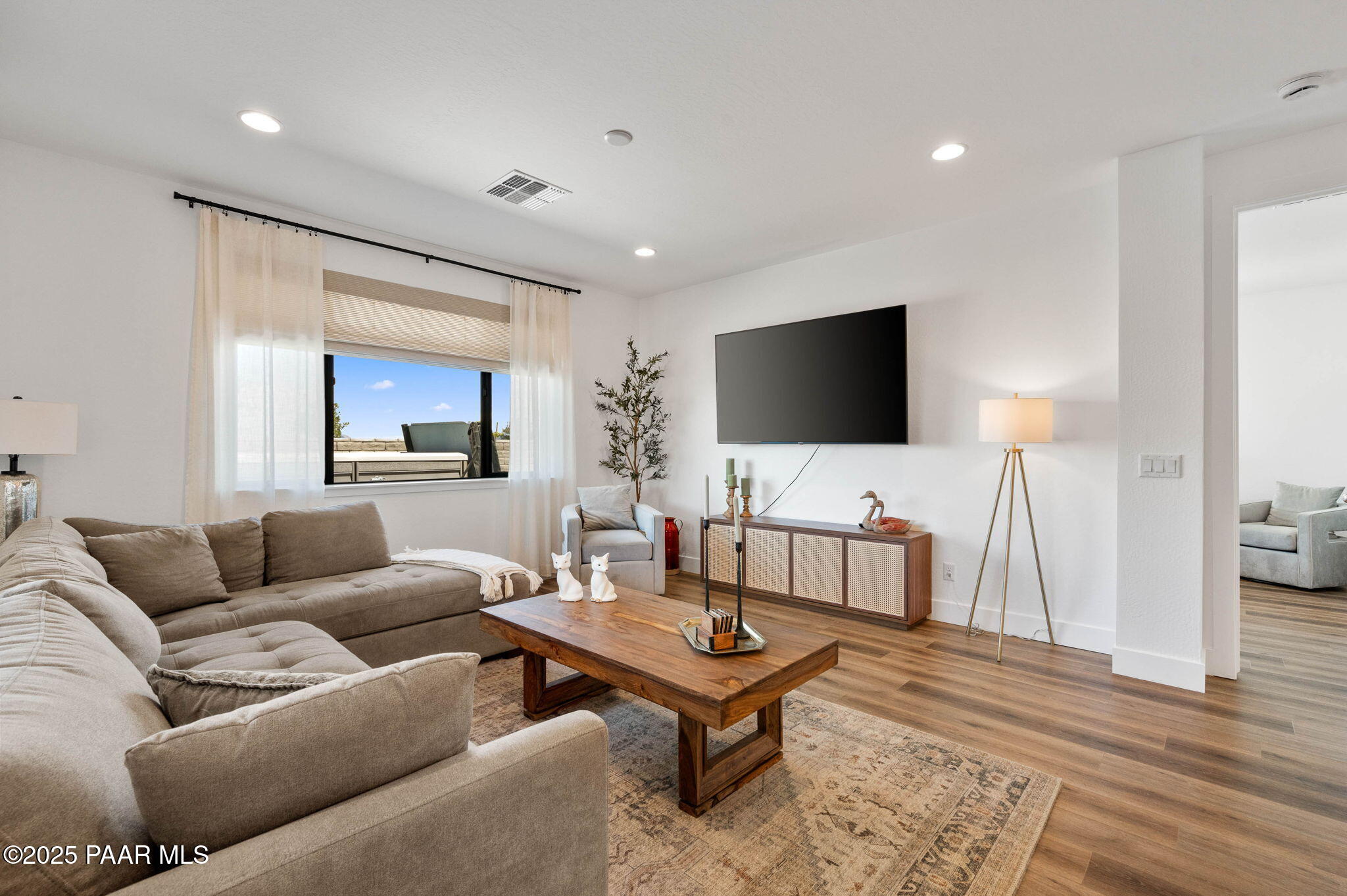 5902 Finch Place Prescott Valley, AZ 86314 - Photo 7 of 116 a living room with furniture and a flat screen tv