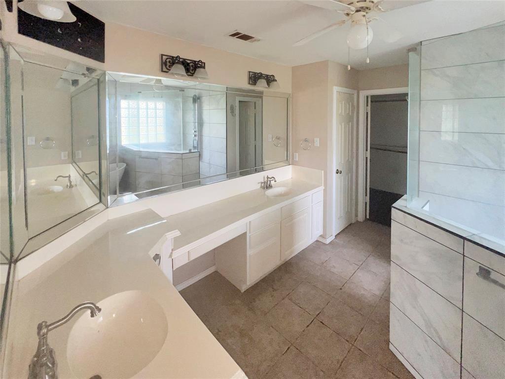 3661 Emo Street Midlothian, TX 76065 - Photo 15 of 24 a bathroom with a tub sink and mirror