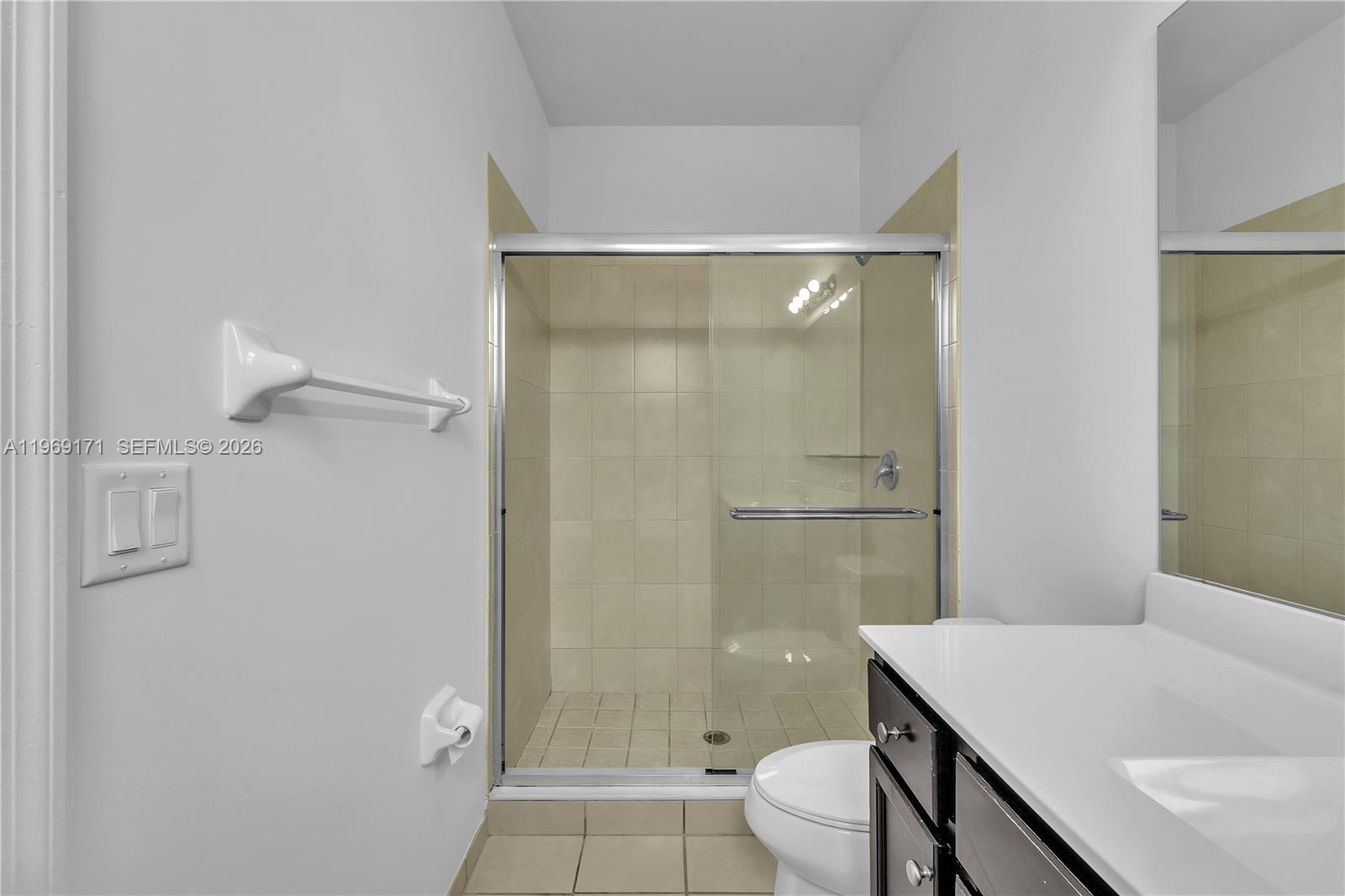 11563 Southwest 248th Lane Homestead, FL 33032 - Photo 19 of 28 a bathroom with a sink toilet and shower