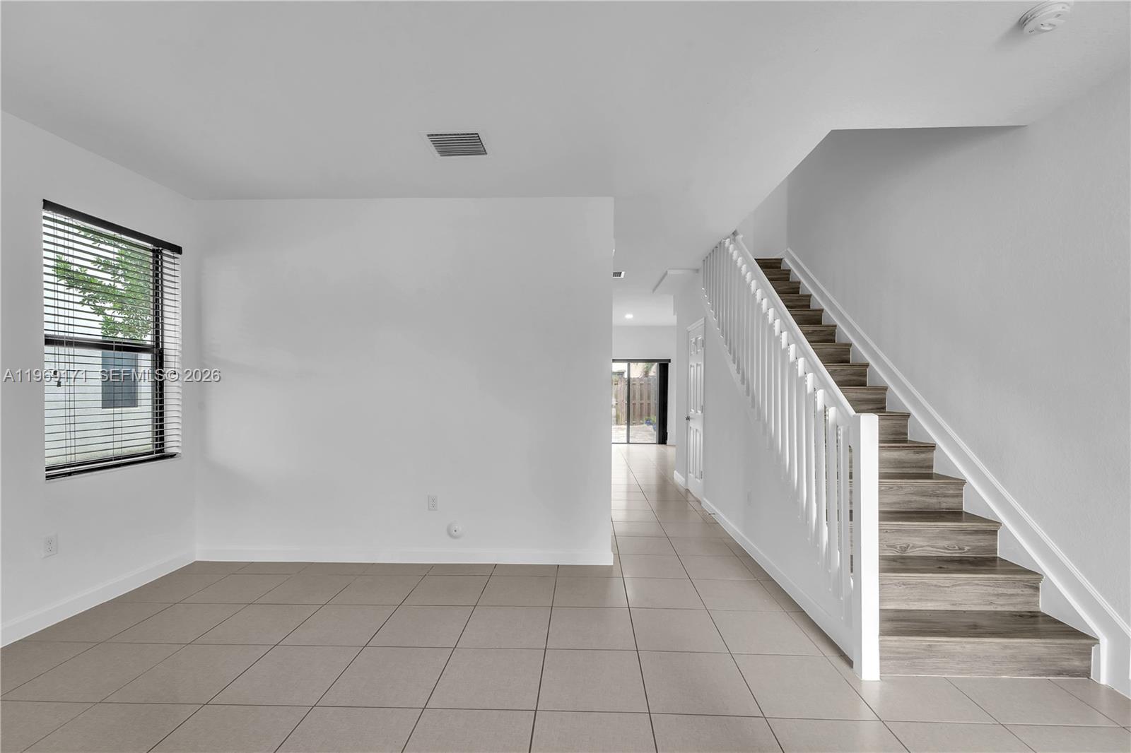 11563 Southwest 248th Lane Homestead, FL 33032 - Photo 2 of 28 a view of an entryway with stairs