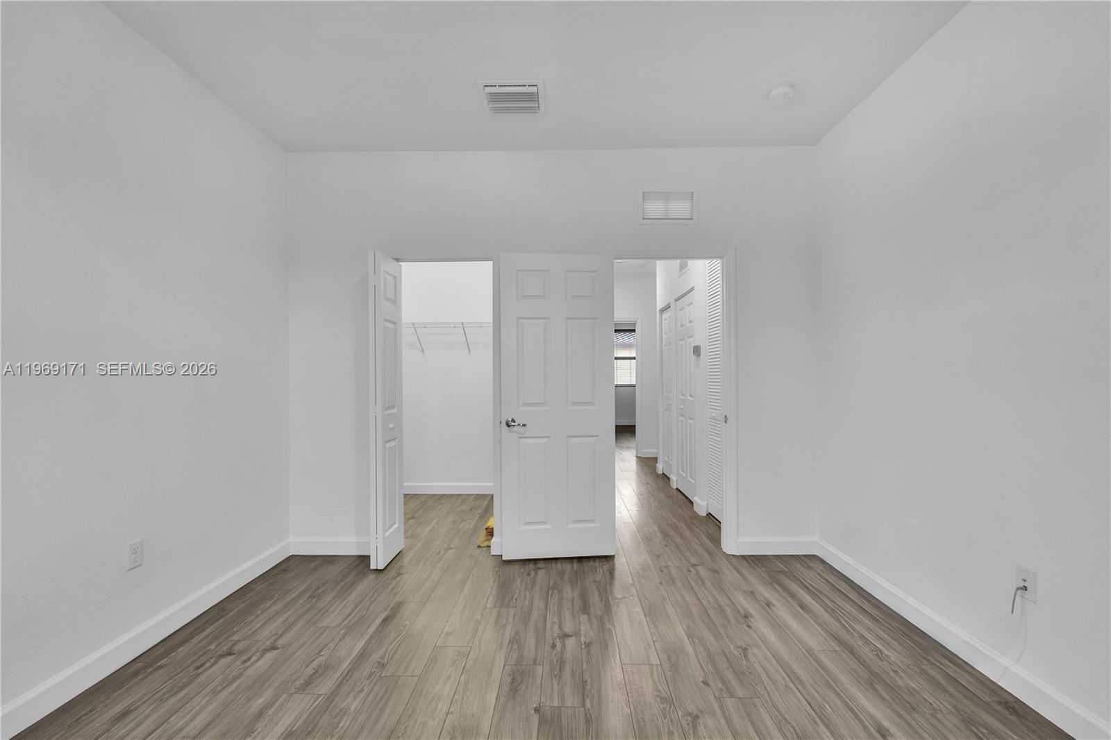 11563 Southwest 248th Lane Homestead, FL 33032 - Photo 21 of 28 a view of empty room with wooden floor