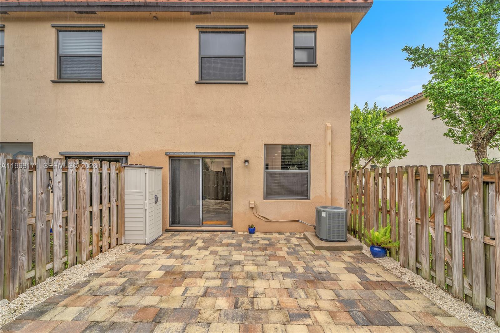 11563 Southwest 248th Lane Homestead, FL 33032 - Photo 23 of 28 a view of a dinning room with a fence