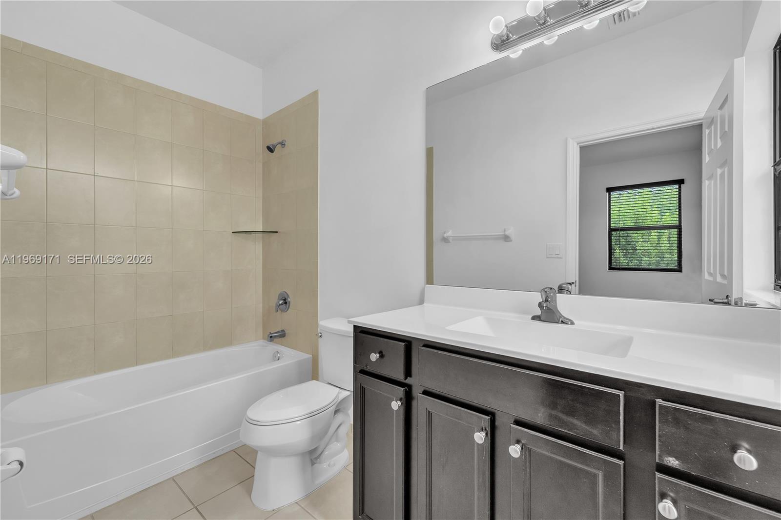 11563 Southwest 248th Lane Homestead, FL 33032 - Photo 24 of 28 a bathroom with a sink a toilet and shower