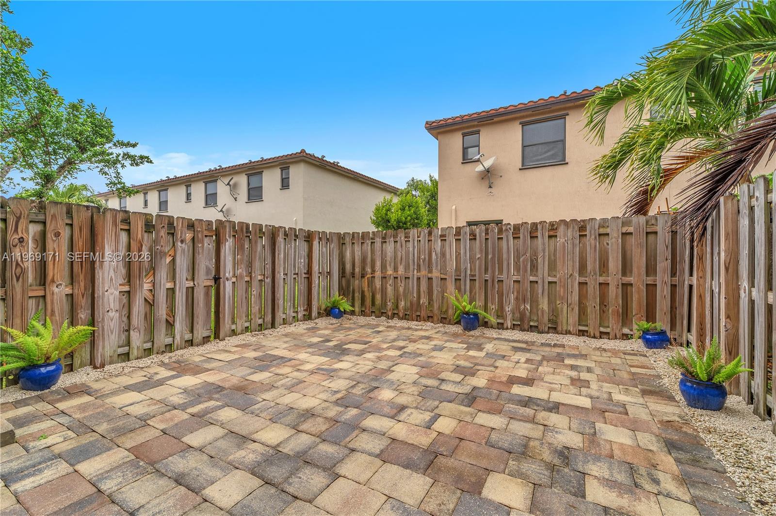 11563 Southwest 248th Lane Homestead, FL 33032 - Photo 26 of 28 a backyard of a house with table and chairs