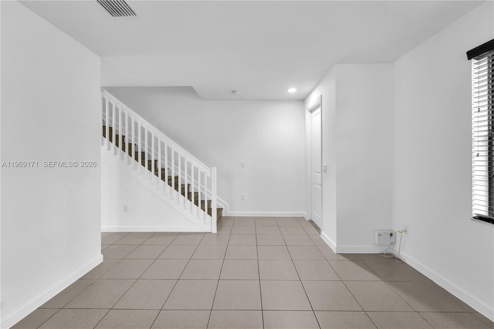 11563 Southwest 248th Lane Homestead, FL 33032 - Photo 3 of 28 a view of an entryway with a window
