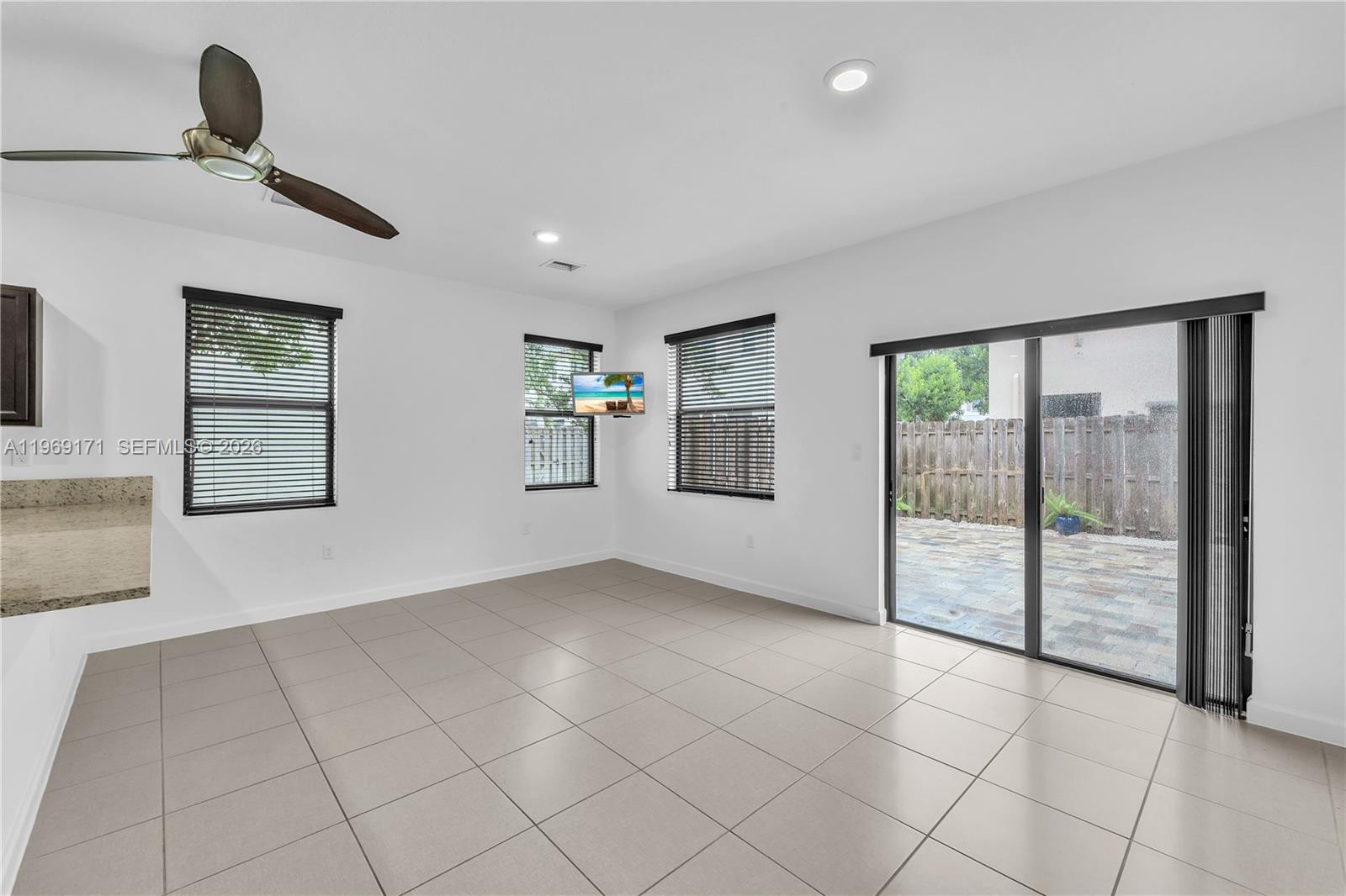 11563 Southwest 248th Lane Homestead, FL 33032 - Photo 8 of 28 a view of an empty room and window