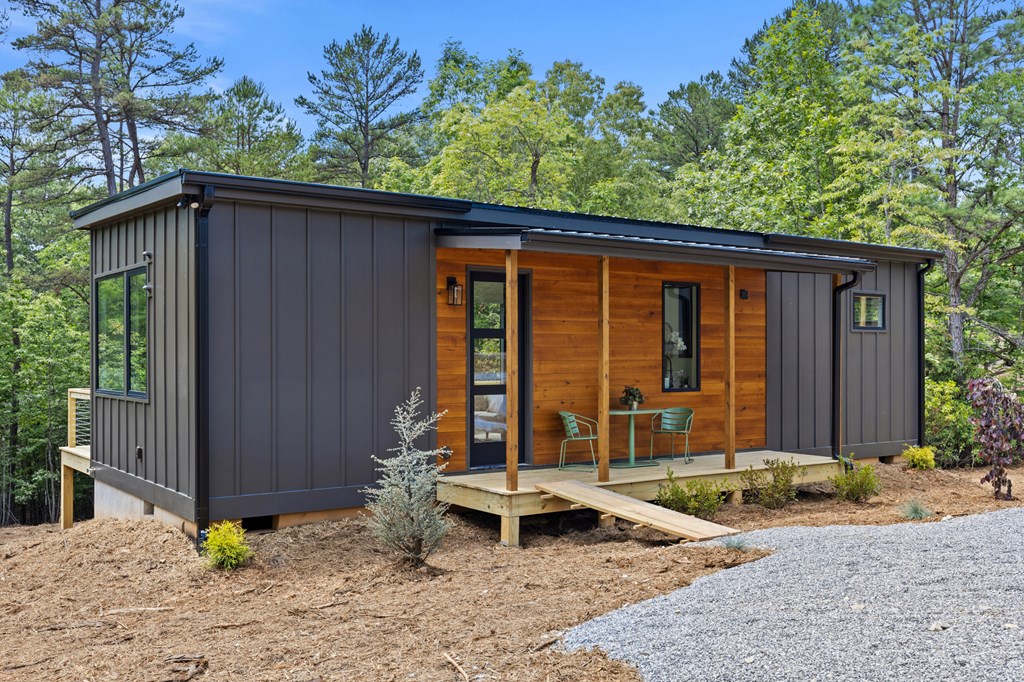 208 Brannon Ridge Young Harris, GA 30582 - Photo 2 of 21 a front view of a house with garden