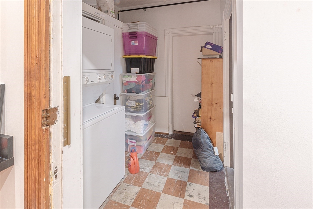 50 St Paul Street, Unit 4 Brookline, MA 02446 - Photo 18 of 21 a hallway with a dining table and a mirror
