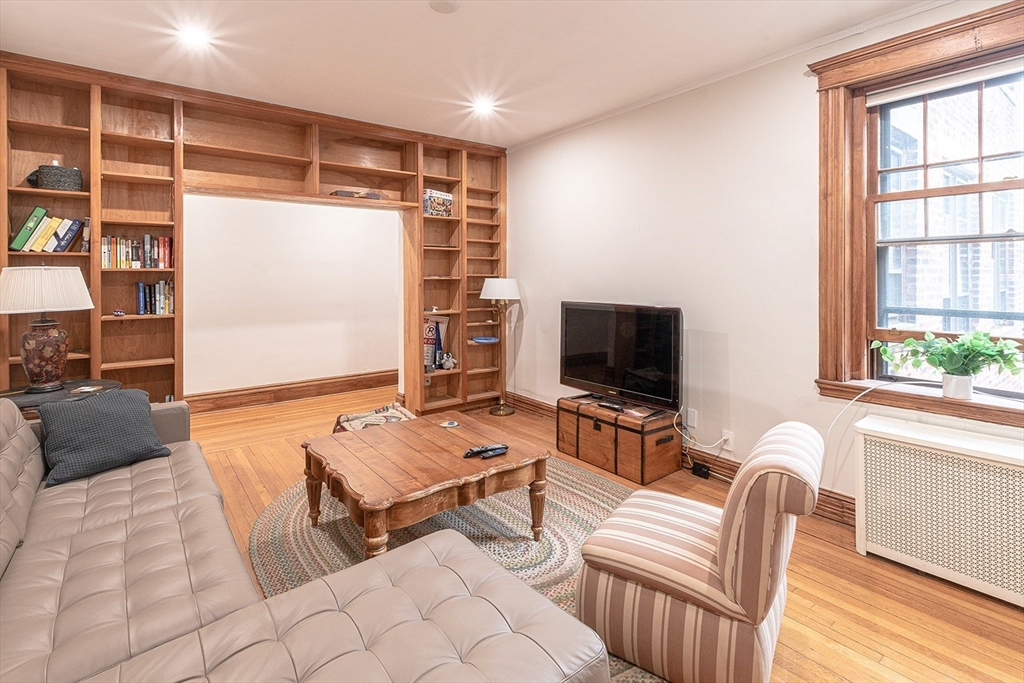 50 St Paul Street, Unit 4 Brookline, MA 02446 - Photo 2 of 21 a living room with furniture and a flat screen tv