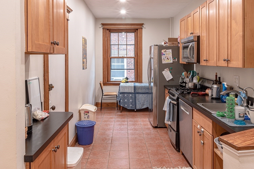 50 St Paul Street, Unit 4 Brookline, MA 02446 - Photo 7 of 21 a view of a kitchen with furniture and a window