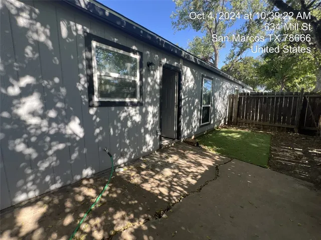 a view of backyard with pathway