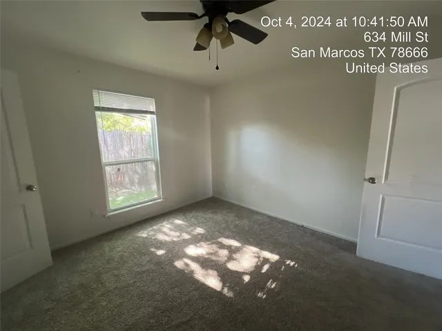 a view of an empty room and window
