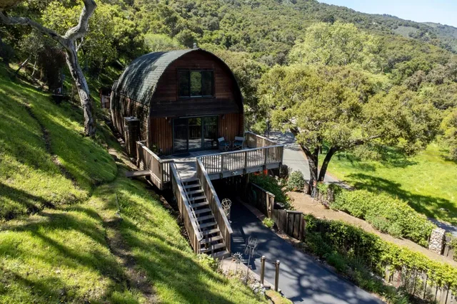 a balcony with wooden floor and fence