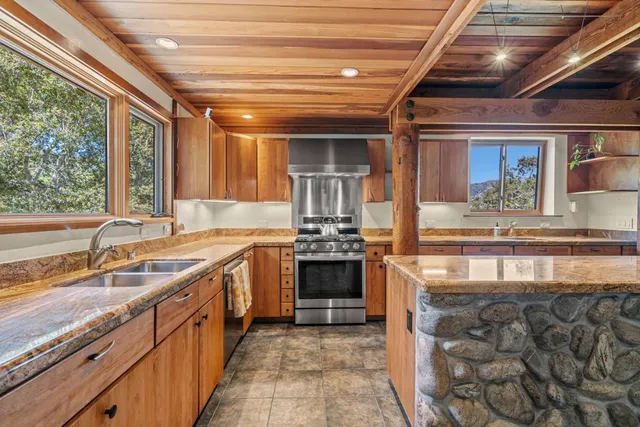 a view of a kitchen with washer and dryer
