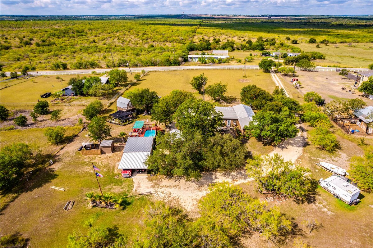 2411 Rohde Road Kyle, TX 78640 - Photo 38 of 40 Mature trees and open pasture land surround this expansive rural homestead.