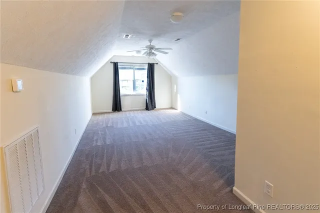 a view of a hallway with a chandelier