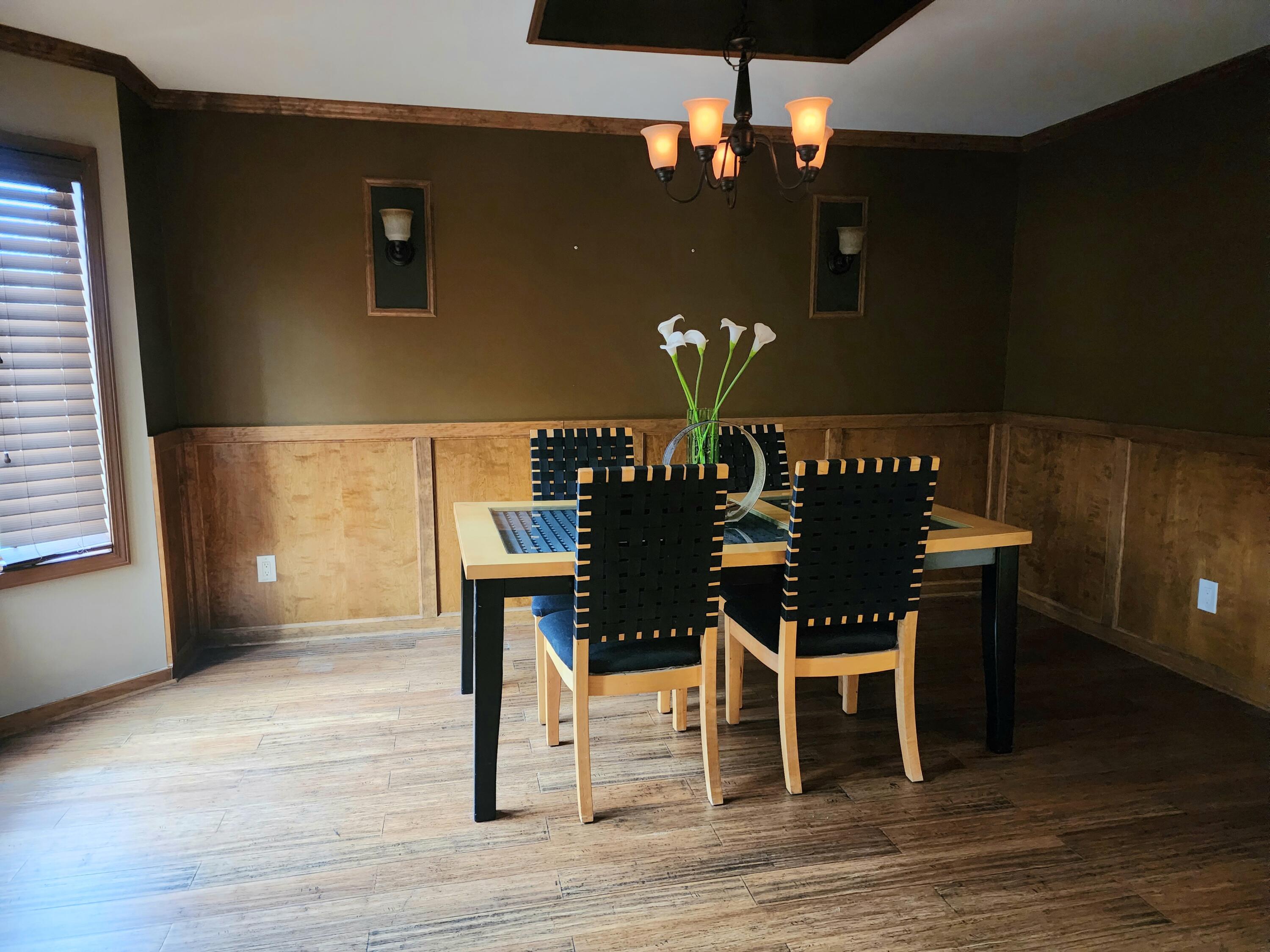 1407 Tyler Court Crown Point, IN 46307 - Photo 13 of 24 a dining room with furniture and wooden floor
