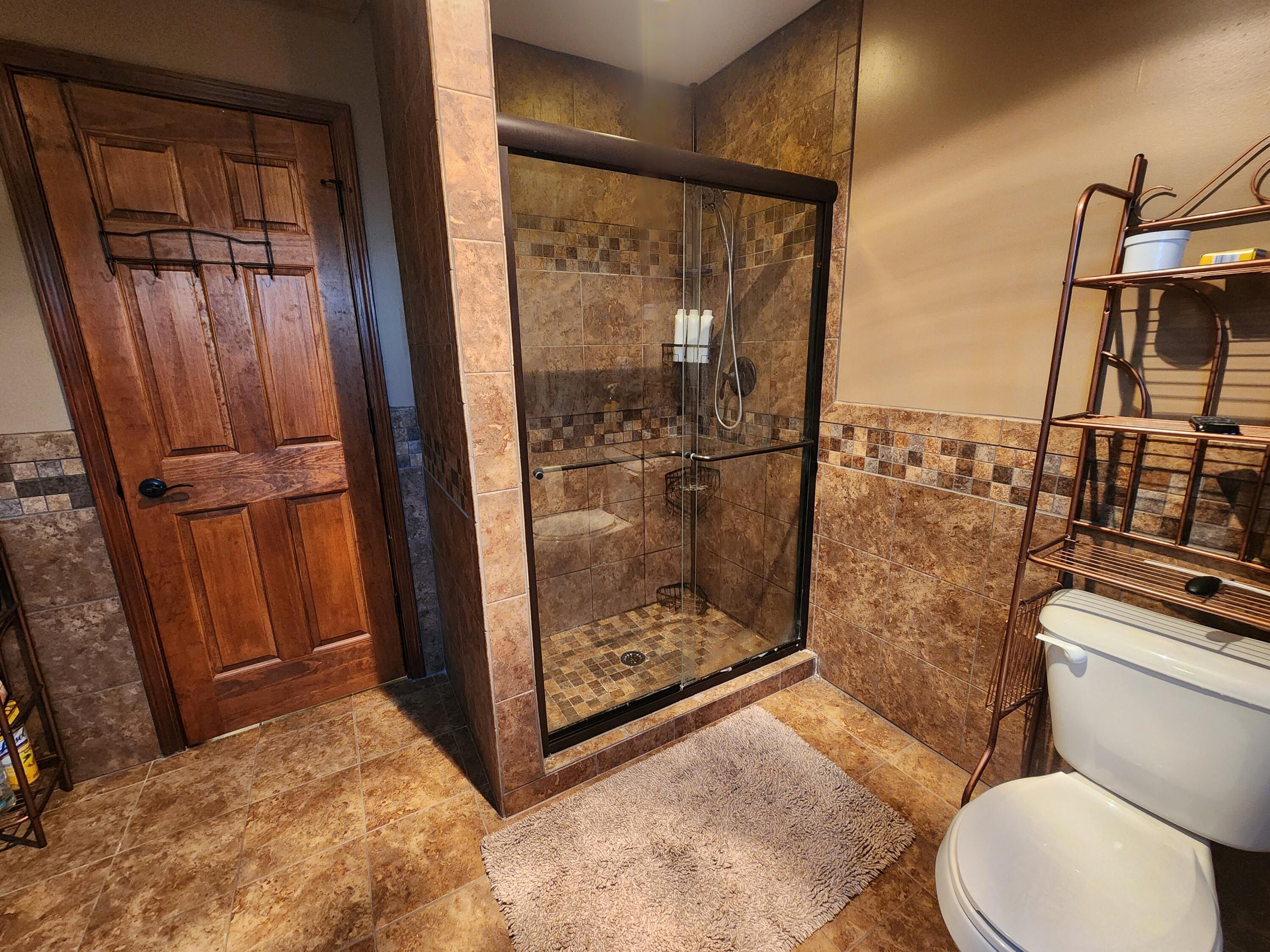 1407 Tyler Court Crown Point, IN 46307 - Photo 19 of 24 a bathroom with a toilet and a shower