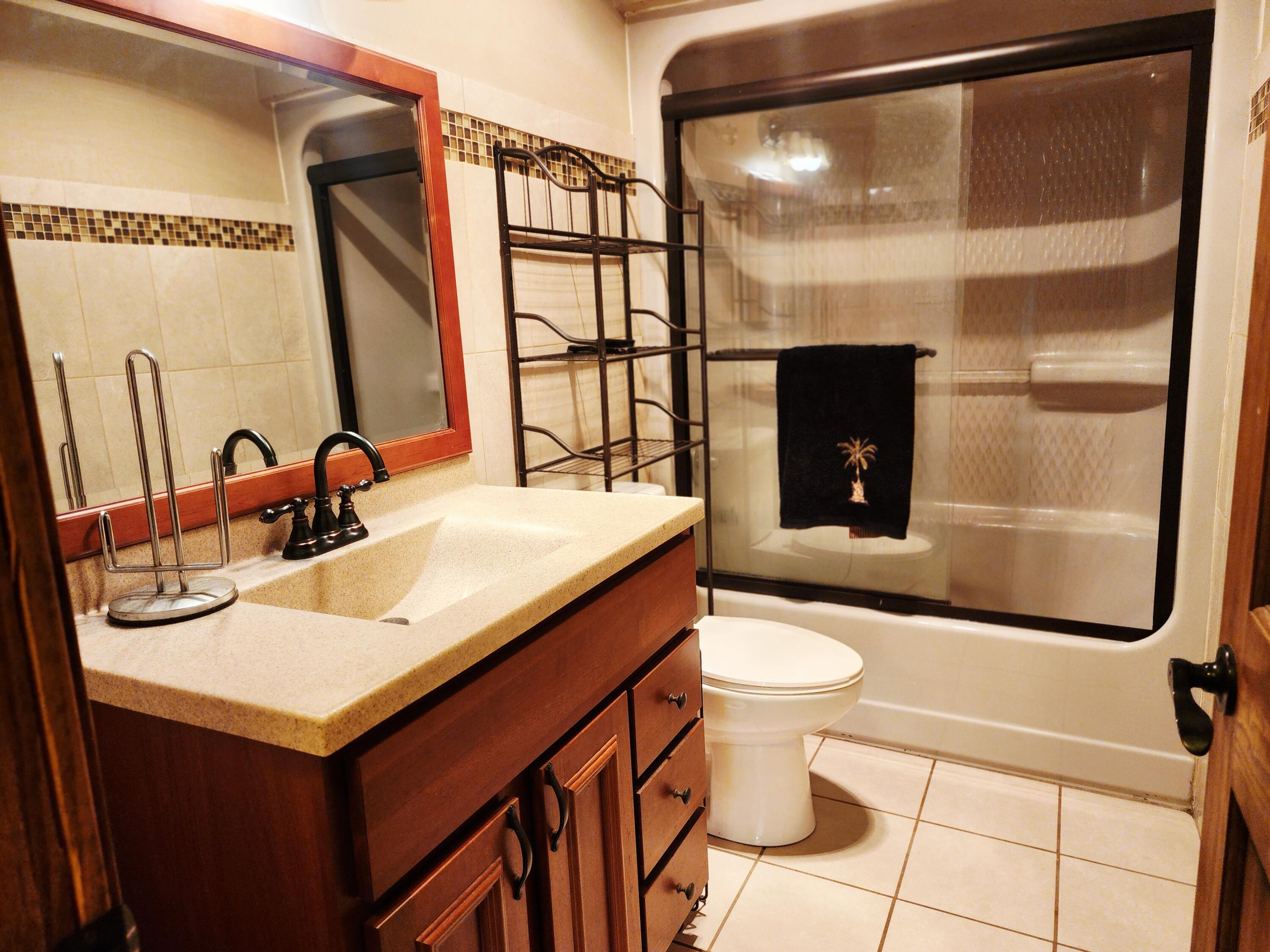 1407 Tyler Court Crown Point, IN 46307 - Photo 20 of 24 a bathroom with a sink and a toilet