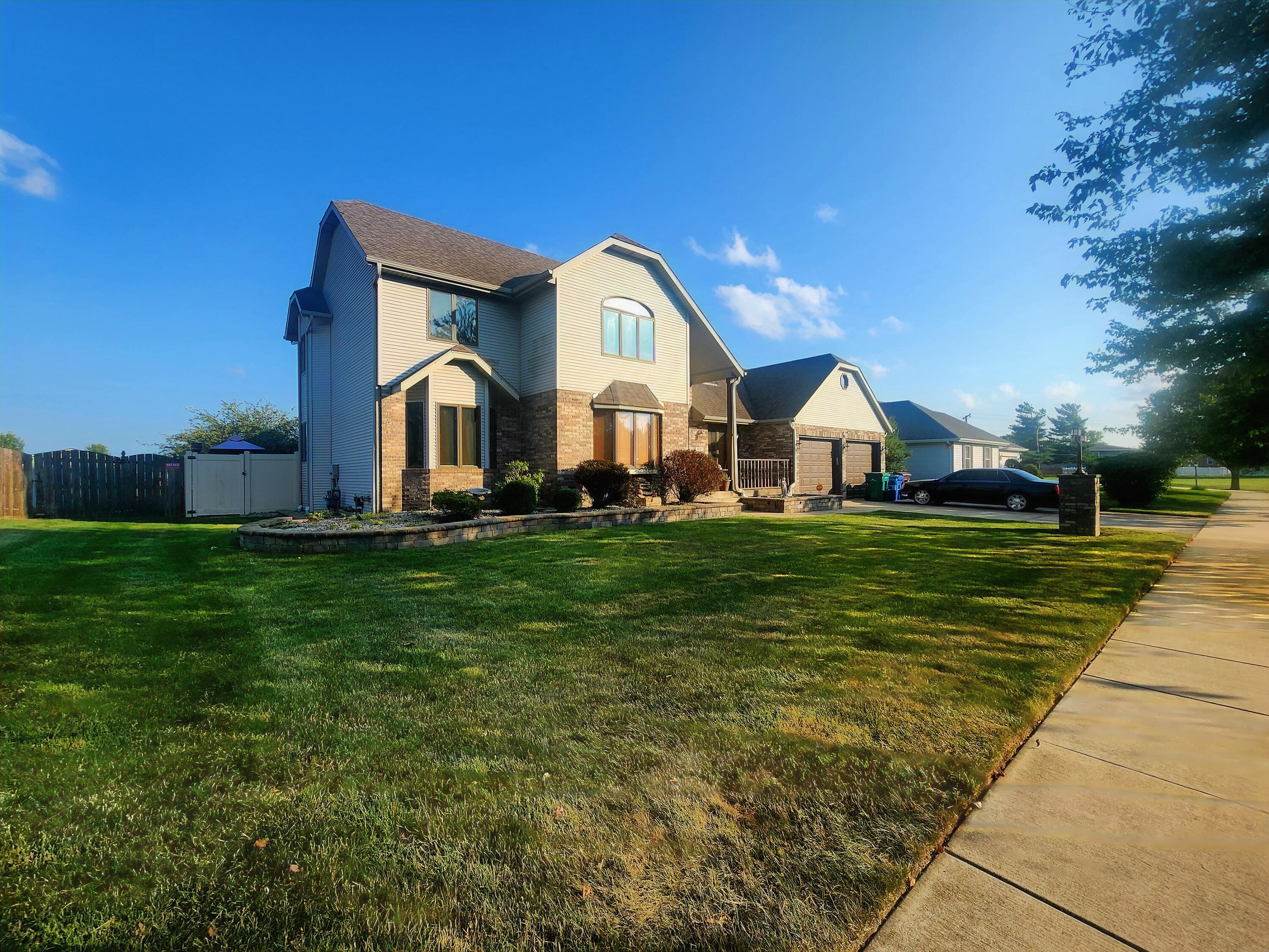 1407 Tyler Court Crown Point, IN 46307 - Photo 24 of 24 a front view of a house with garden