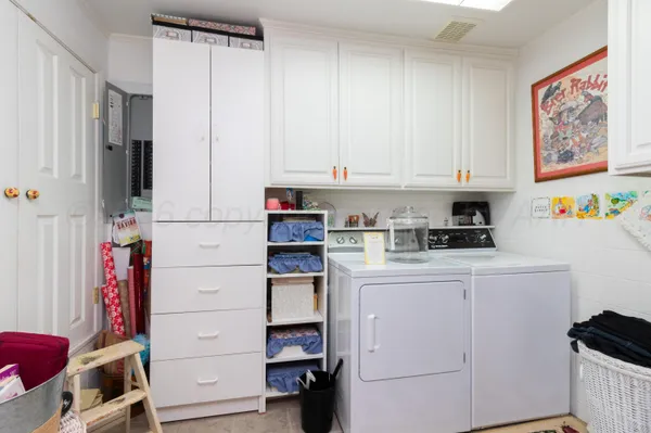a kitchen with sink and cabinets