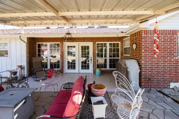 a outdoor space with patio lots of furniture and garden view