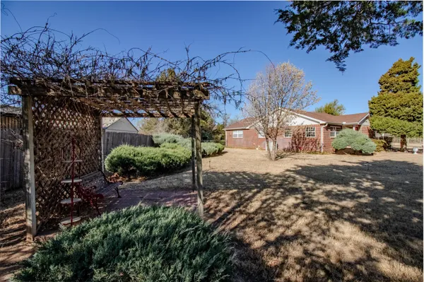 a front view of a house with a big yard