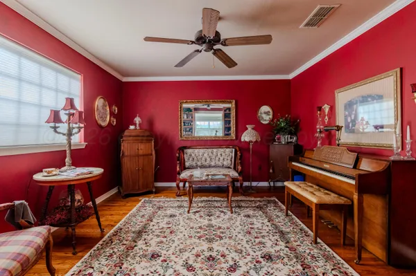 a living room with furniture and a rug