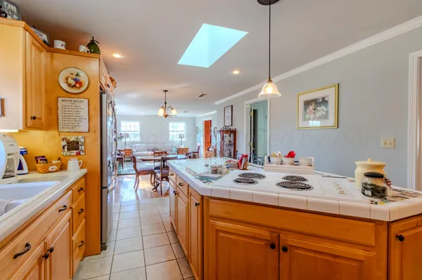 a kitchen with a sink appliances and cabinets