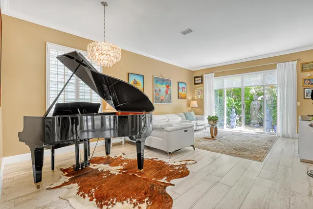 a view of a house with swimming pool and sitting area