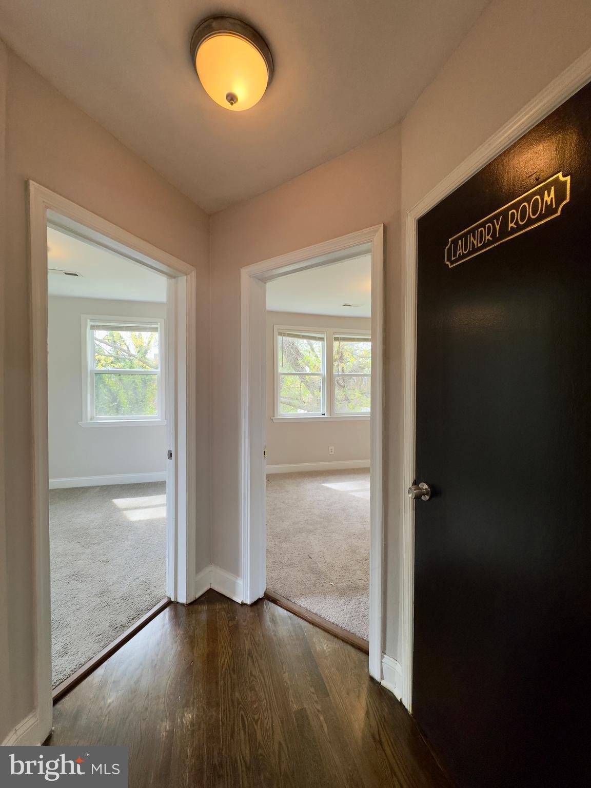 1111 Gleneagle Road, Unit 2 Baltimore, MD 21239 - Photo 6 of 11 wooden floor in an empty room