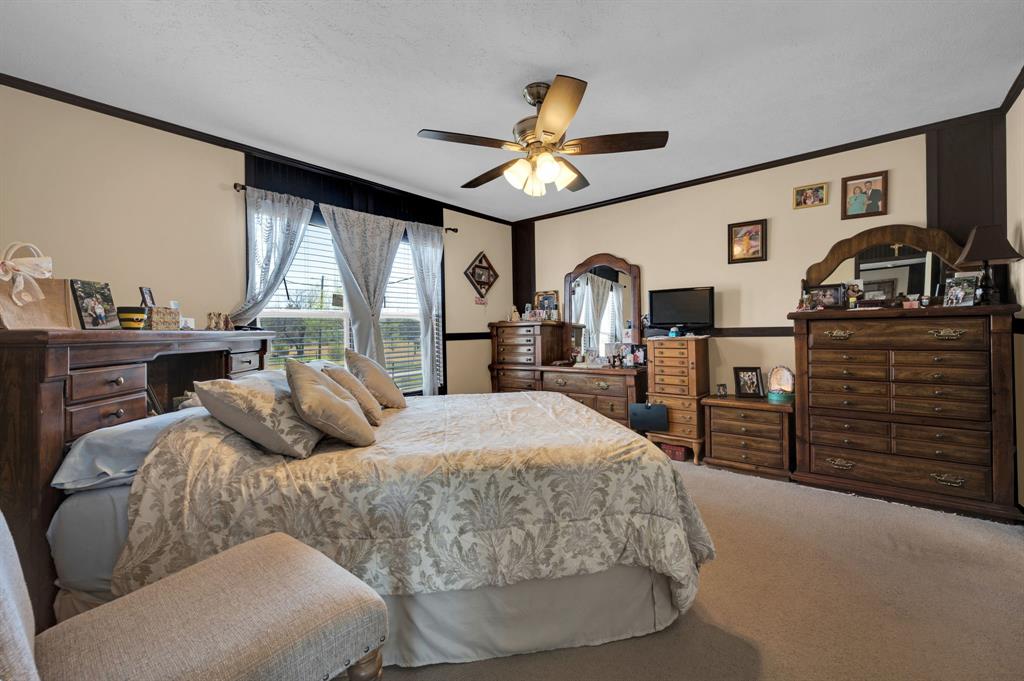 12032 County Road 0190 Rice, TX 75155 - Photo 12 of 40 a bedroom with a bed and wooden floor