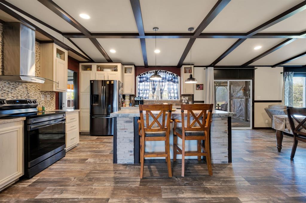 12032 County Road 0190 Rice, TX 75155 - Photo 21 of 40 a large kitchen with a table and chairs