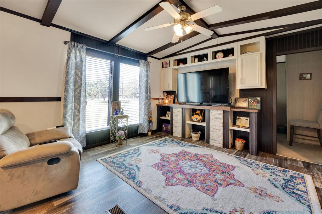 12032 County Road 0190 Rice, TX 75155 - Photo 22 of 40 a living room with furniture and a flat screen tv