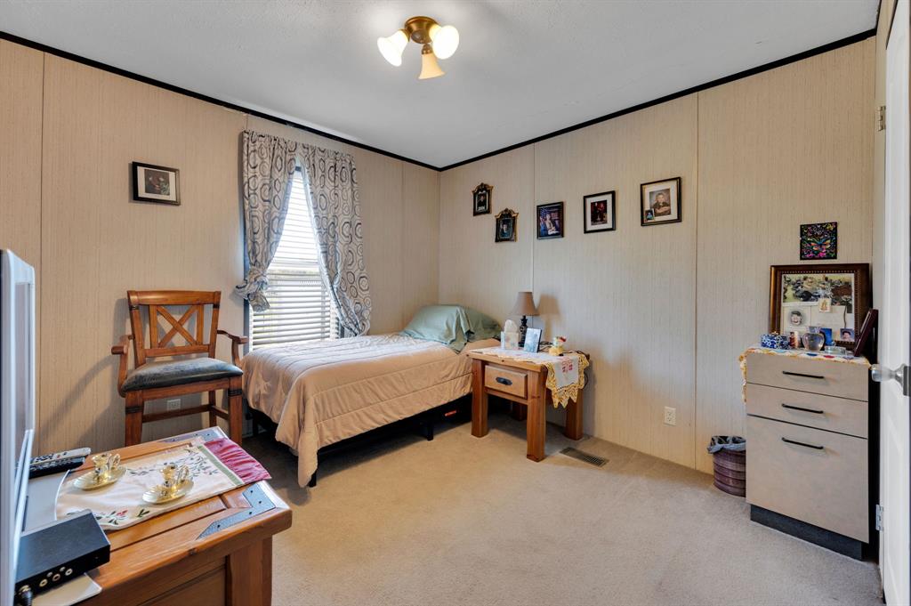 12032 County Road 0190 Rice, TX 75155 - Photo 29 of 40 a bed room with a bed and a window