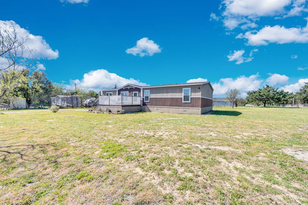 12032 County Road 0190 Rice, TX 75155 - Photo 4 of 40 a view of a house with a yard