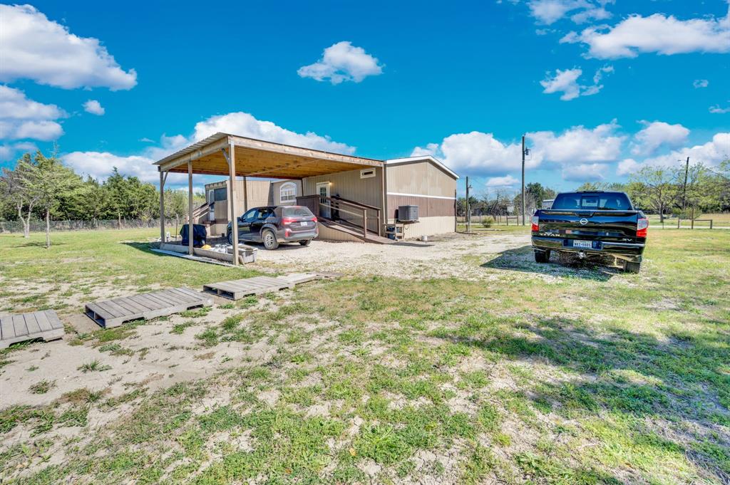 12032 County Road 0190 Rice, TX 75155 - Photo 7 of 40 a view of a house with a yard