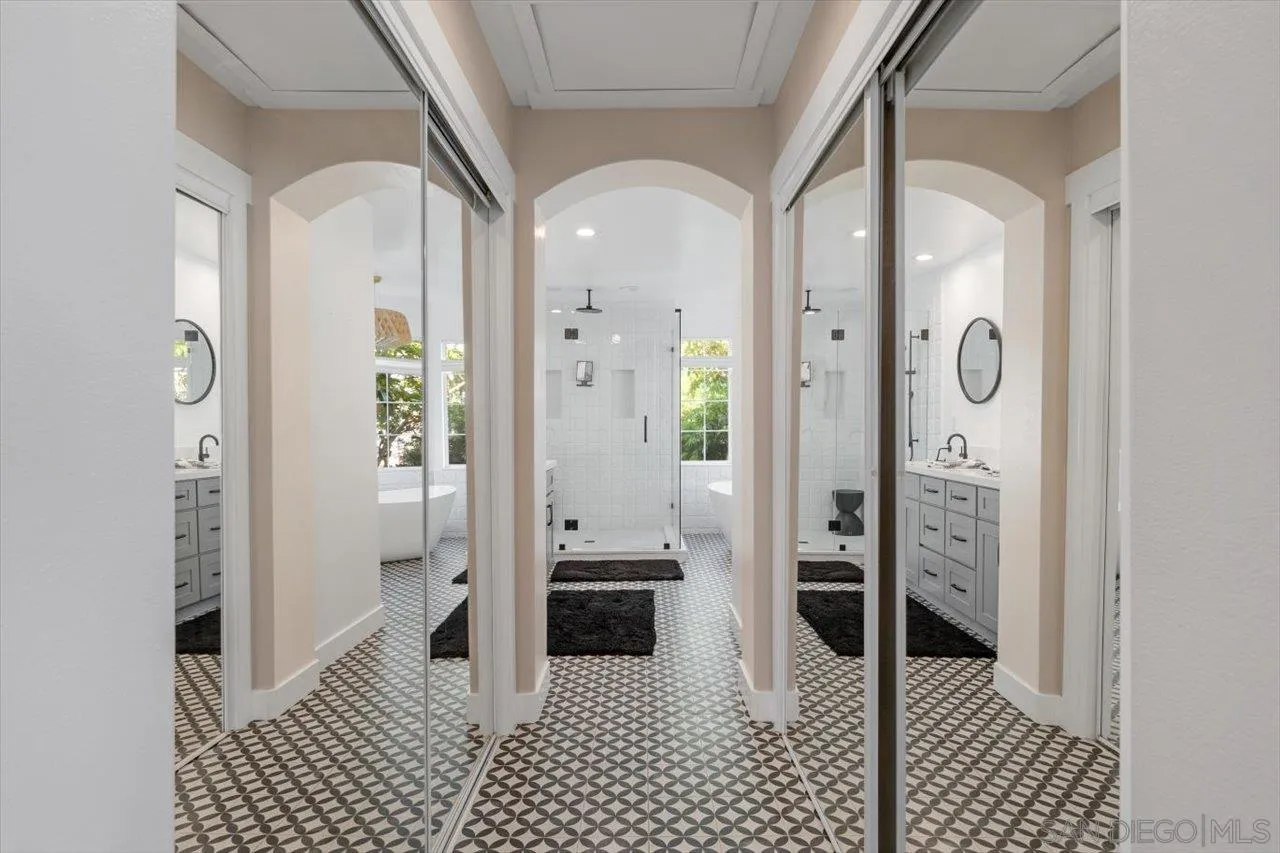 219 Jacob Lane Encinitas, CA 92024 - Photo 21 of 46 a bathroom with a glass shower door and a bathtub